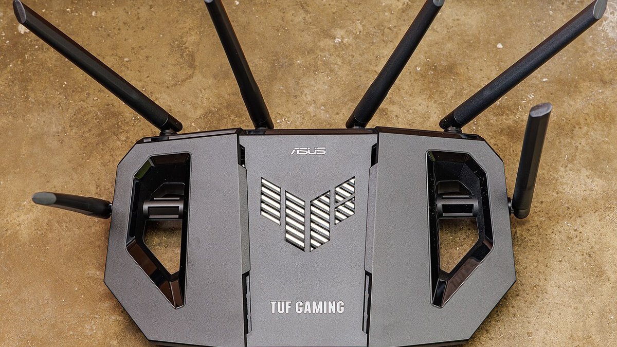 An ASUS TUF gaming router with its antennas extended
